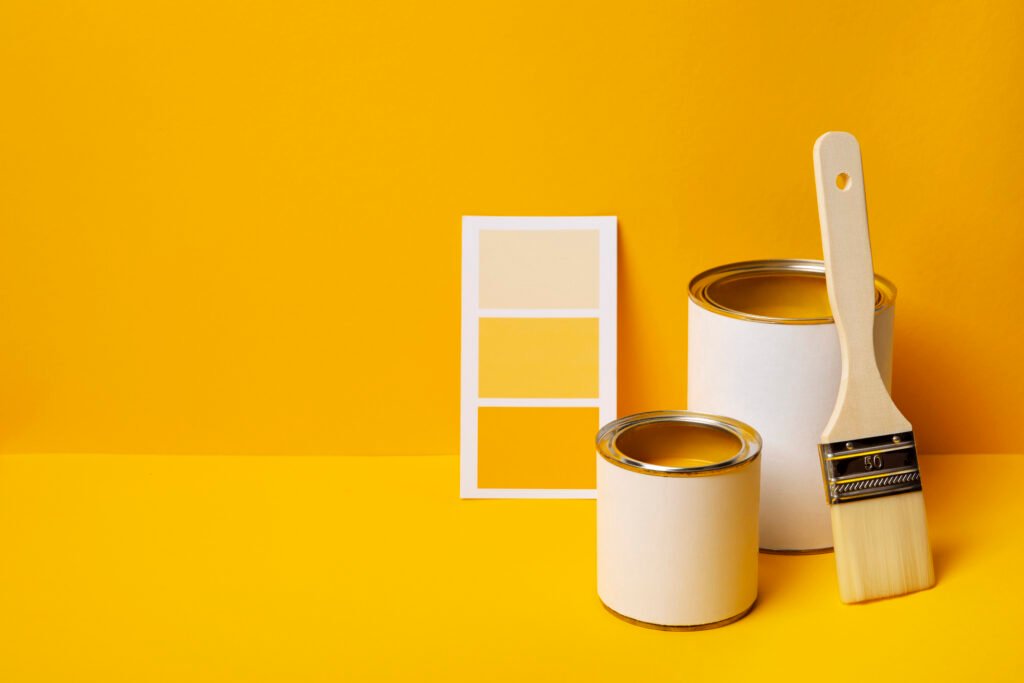 cans with yellow paint high angle